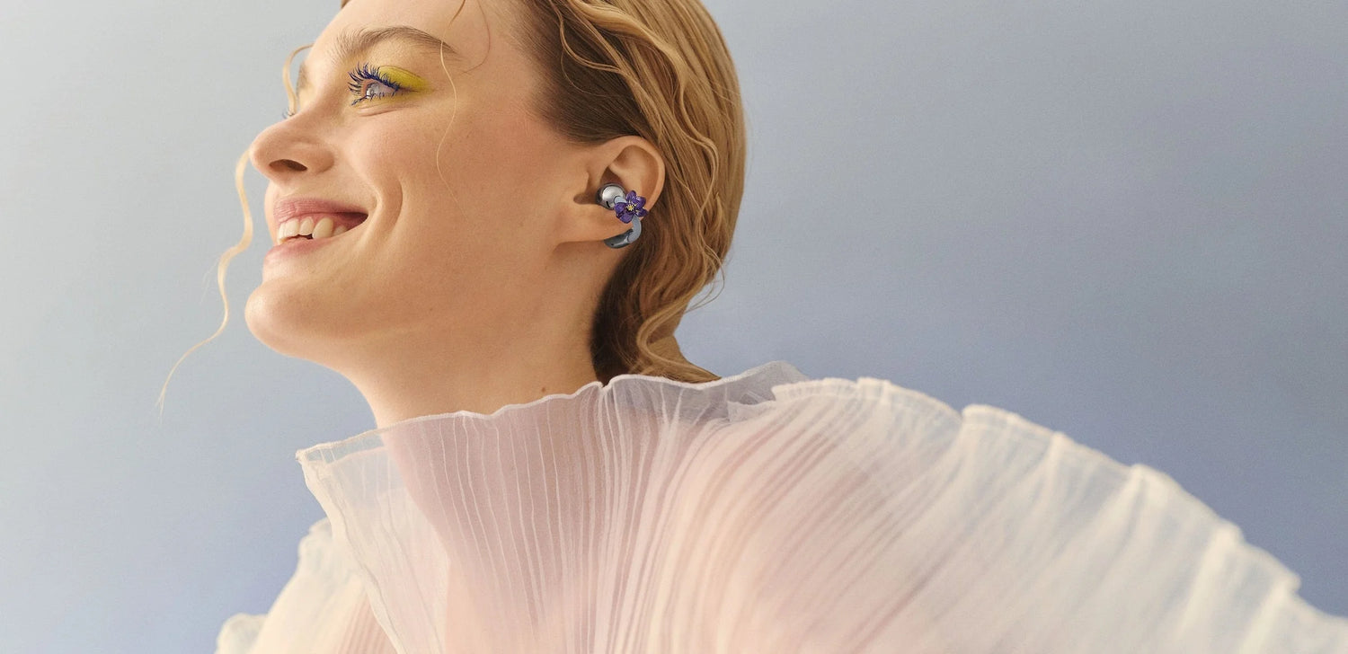 Woman wearing a white blouse against a light blue sky