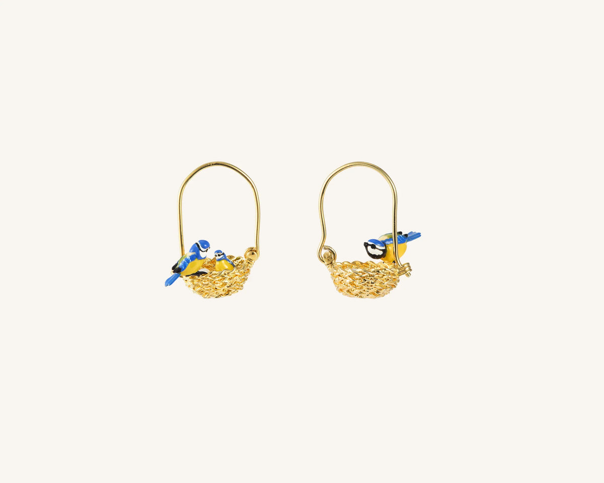 Pair of gold earrings with diamond accents on a white background